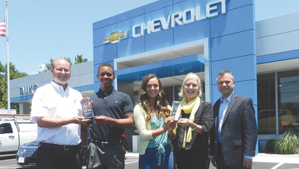 Nansemond River High School baseball and softball stars Kieton Rivers and Lauren Maddrey, respectively, commemorate their status as the male and female Duke Automotive-Suffolk News-Herald Spring Players of the Year. From left: Duke Automotive vice president Eley Duke, Kieton Rivers, Lauren Maddrey, Duke Automotive president Lydia Duke and Suffolk News-Herald publisher Steve Stewart.