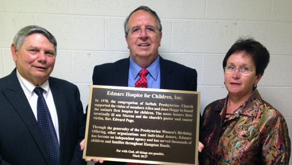 From left, Don White, Bruce Sharp and Nancy King, all current or former board members at Edmarc Hospice for Children, show a plaque that will be dedicated today at Suffolk Presbyterian Church recognizing the church’s founding role in Edmarc. (Submitted Photo)