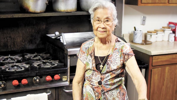 The kitchen inside the old Salvation Army building on Bank Street is familiar territory for Magdalena Barnes, 85, who has led the soup kitchen efforts of Suffolk’s four Episcopal churches for 25 years.