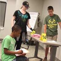 At the Suffolk Health and Human Services Building on Thursday, budding sleuths Lamont Jones, a rising freshman at King’s Fork High School; Rachel Henk, a rising sophomore at Smithfield High School; and Hunter Caron, who’ll be a sophomore at Forest Glen Middle School in the fall, scrutinize a “crime scene” during a segment of the Suffolk Commonwealth’s Attorney’s Forensics Camp.
