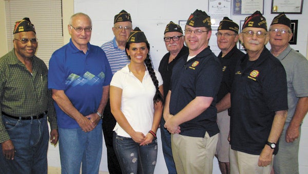 The Veterans of Foreign Wars Post 2582 has doubled in size this year and also obtained its first female commander, Petty Officer 2nd Class Nicky Morrison, pictured at left on the front row at her installation. With her on the front row are Post 2582 member Ken Wiseman, center, and State Jr. Vice Commander Doug Keller, left. In the back row are Post 2582 members, from left, George E. Martin, Jimmie Harrell, Benny Plewes, Robert Brady, Denis Confer and Thomas Queen.