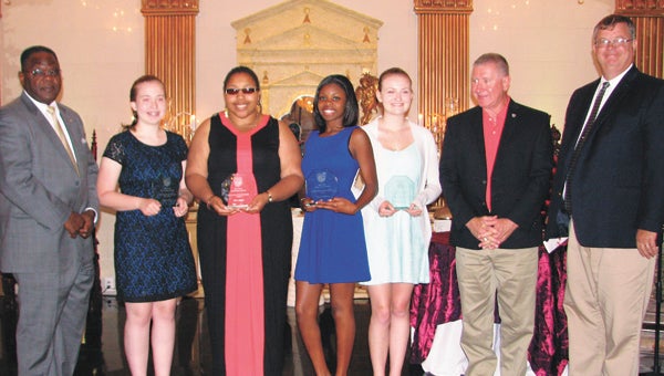 Suffolk Youth Achievement Award winners show off their awards in a photo with City Council members. From left are Vice Mayor Charles Brown, Madison Hansen, Alicia Jiggetts, Chelsea Whitney, Brittany Harrison, and Councilmen Roger Fawcett and Charles Parr.