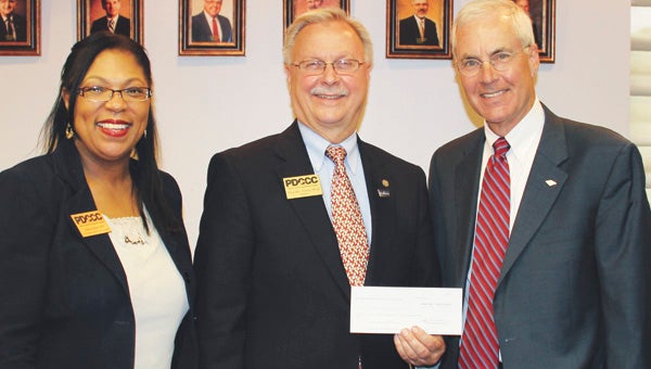 From left, Paul D. Camp Community College Vice President for Institutional Advancement Felicia Blow and President Paul Conco accept a donation from Charles R. Henderson Jr., senior vice president and Hampton Roads Bank of America market president. 