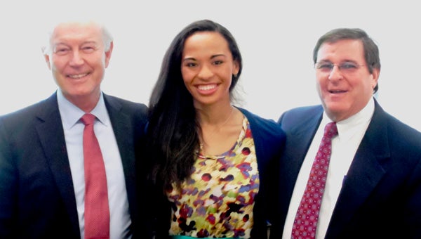 Scholarships: Robert Blair, left, chairman of the Mast Scholarship Selection Committee, and Donald Goldberg, selection committee member, present two Suffolk Foundation scholarships to Destanie Fonoimoana. She earned both the $5,000 Howard D. Mast Memorial Scholarship and the $2,500 Col. Fred V. Cherry Scholarship.