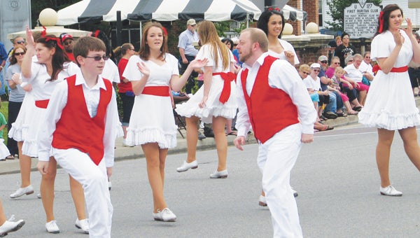 The Peanut City Cloggers, including Harrison Storms and Bob Greene in the foreground, perform during the 2013 Ruritan Founders’ Day Parade in Holland. Storms and Greene were among many cloggers to come away from a recent North Carolina competition with individual first-place awards, and the team also earned a raft of first-place nods.