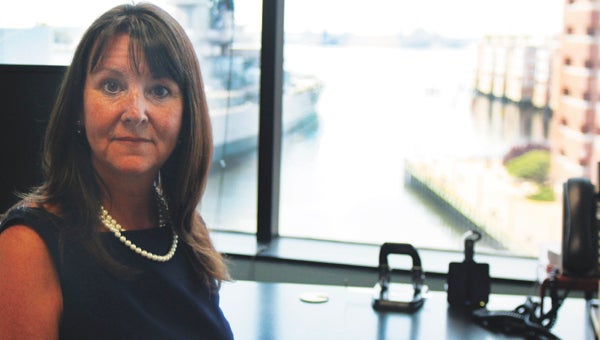 Pictured in her law firm’s downtown Norfolk office, Suffolk resident Deborah Waters has been tapped to serve on the Virginia Port Authority Board of Commissioners. Waters is an accomplished expert in maritime, which she hopes to put to good use for the Commonwealth.