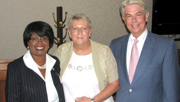 Sylvia Duck, center, celebrated her July 31 retirement on Thursday with City Manager Selena Cuffee-Glenn, left, and Treasurer Ron Williams. She is retiring as the deputy chief treasurer after 40 years of service to the city.
