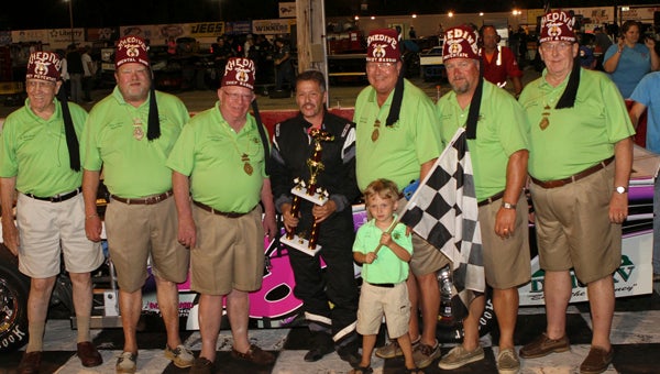 Shawn Balluzzo stands with Shriner trophy presenters after his second 50-lap win of the night at Langley Speedway on Saturday. 