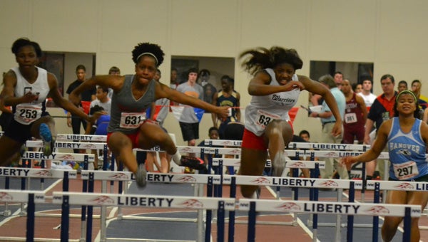 Nansemond River High School rising senior track and field star Zakiya Rashid, center, is currently a focus of the intense college recruiting process that accompanies talented student-athletes.