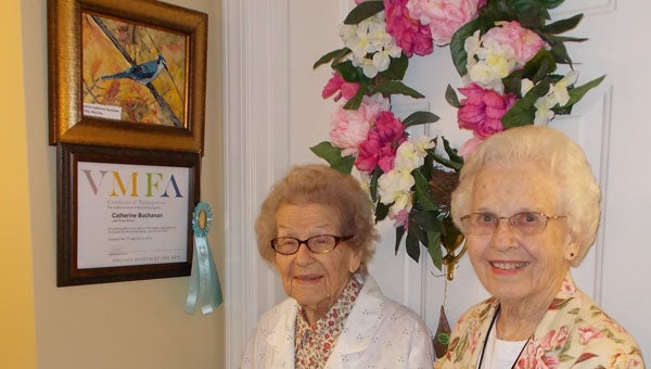 Kitty Buchanan and Betty Chapman, mother and daughter, live at Lake Prince Woods. Buchanan took up painting after moving there and even won an award in a statewide art show for retirement communities. (Submitted Photo)