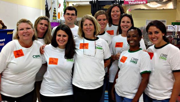 Ten employees of CBRE|Hampton Roads recently helped sort about 1,600 potatoes for the Foodbank of Southeastern Virginia and the Eastern Shore. Participants included: front row, from left, Maddy Jordan, Alyse Carpenter, Judi Knouf, Shawnay English and Megan Patrick; and, back row, from left, Lara Hammje, Jack Aspinwall, Kendall Korte, Deb Thaxton and Stephani Renfrew. (Submitted Photo)