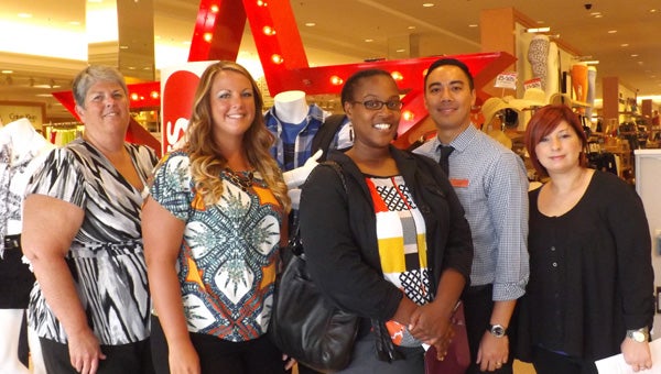Michele Duncan and Lisa Quinn, marketing education teachers with Suffolk Public Schools, and Adrianne Young, a marketing education teacher from Newport News, join Macy’s sales managers Reggie Clemente and Rhianna Hofstetter on a behind-the-scenes tour of the company’s Lynnhaven Mall store. (Submitted Photo)