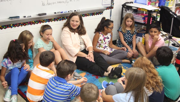 During Nansemond-Suffolk Academy’s first day back for 2014-2015 on Wednesday, fourth-grade teacher Maryanne Persons gets to know her young charges.