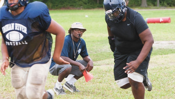 Former Lakeland High School and Hampton University football coach Glenwood Ferebee works with his new players at Indian River High School on Monday, freshly appreciating certain opportunities that were less present at the college level.