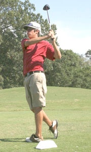 Nansemond River High School junior Ryan Fischer, a top 2014 Warriors player, tees off on No. 18 at Sleepy Hole Golf Course while competing against King's Fork High School on Wednesday.