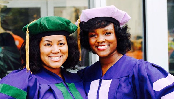 Fraternal twins LaShawndra Walker, left, and Charmaine Walker, are separated for the first time as they begin their residencies after graduating from Howard University’s colleges of medicine and dentistry, respectively.