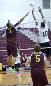 King's Fork High School junior outside hitter DreQuan Wilson, left, is a go-to player for the Bulldogs this season. (Caroline LaMagna photo)