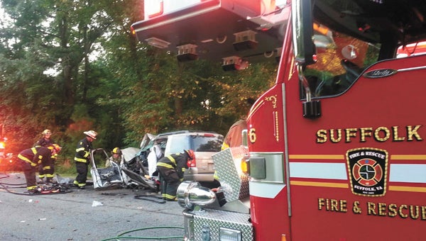 Suffolk firefighters work the scene of a crash on Monday morning on Godwin Boulevard. The driver and passenger from this Ford Explorer both were injured. (Courtesy City of Suffolk)