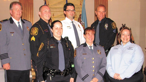 Suffolk Police Department promotees pose for a photo with Suffolk Police Chief Thomas Bennett, top left. Also in the top row are, from left, Sgt. Jeffrey Lurie, Lt. Kevin Harrison and Master Police Officer Paul Hutta. On the bottom row are Sgt. Jennifer Weatherly, Capt. Janet Brandsasse and Emergency Communications Operator Supervisor Erin Hughes. Also promoted was Lt. John McCarley, who is deployed with the U.S. Air Force.