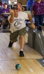 Shane Cartner of Churchland bowls as other players in the Suffolk Mixed Duckpin Bowling League look on at the Victory Lanes Bowling Center in Portsmouth on Tuesday night.
