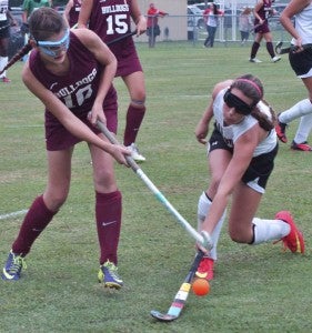 King’s Fork High School's Hannah Marston, left, tries to push the ball past Nansemond River High School's Ashlyn Rogers on Monday during a contest that went to strokes. (Caroline LaMagna photo)