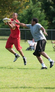 Jeremy Britt, right, makes an attempt to deflect the throw to Tillman Rasberry during the summer season of the Suffolk Ultimate League, which is likely to have a fall season, as well. (Beth Hamilton Photography)
