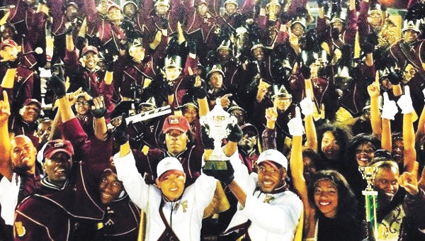 Members of the Mighty Marching Bulldogs, hosts of the Fifth annual Kennel Classic at King’s Fork High School on Saturday, celebrate after a recent competition. (Submitted Photo)