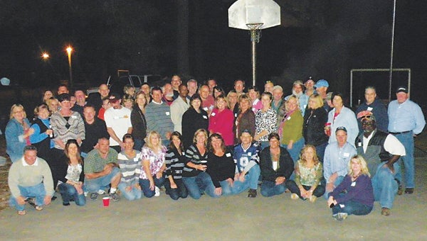 Alumni gather for a photo during a previous Forest Glen High School reunion.  The 2014 event will be held Oct. 25.
