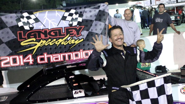 Shawn Balluzzo celebrates his seventh Langley Speedway track championship in the Modifieds Division on Sept. 27, following a 75-lap event. During the track’s season finale, eight championships were decided. (Bill Carr/MotorSports Photo News Service)