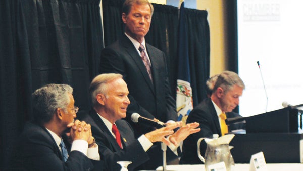 With Rep. Bobby Scott on his right, as well as Hampton Roads Chamber of Commerce President and CEO Bryan Stephens and congressmen Rob Wittman and Scott Rigell, Suffolk’s voice in the U.S. House of Representatives, Randy Forbes, hammers the issues of growing the economy and maintaining military dominance, during a congressional forum in Virginia Beach on Wednesday.