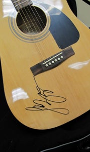 The autographed guitar that ticket purchasers have a chance to win.