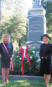 United Daughters of the Confederacy members pose for a photo after a wreath-laying at Cedar Hill Cemetery during their state convention this week. On the left is Virginia Division President Suzie Snyder, with Memorial Chairman Betsy Spencer on the right. (Submitted Photo)