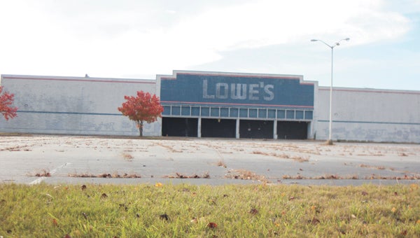 The old Lowe’s building on Godwin Boulevard, owned by a Suffolk-born, New York-based plastic surgeon of world renown, has attracted a string of code violations since 2004.