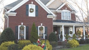 The Tillman home will feature seven themed Christmas trees and a life-sized Santa, as well as Victorian carolers.