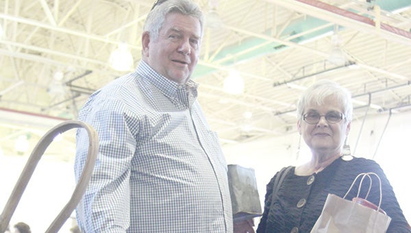 Surry’s Warren and Rosemary Green shop at last year’s Antiques Show and Sale at King’s Fork Middle School. The annual event returns next weekend.