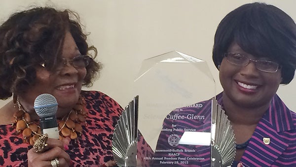 Suffolk City Manager Selena Cuffee-Glenn, right, holds up the Soaring Eagle Award for Outstanding Public Service. The honor was presented on Saturday morning by Costellar Ledbetter, left, president of the Nansemond-Suffolk Branch of the NAACP.