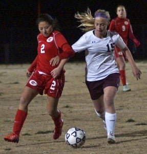 King's Fork High School junior midfielder Logan Montel competes against visiting Grassfield High School during Monday's 2-1 overtime victory for the Lady Bulldogs. (Caroline LaMagna photo)