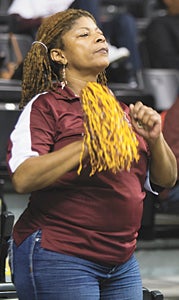 Suffolk’s Sharon Watson cheers for the King’s Fork High School boys’ basketball team during its appearance at Virginia Commonwealth University’s Stuart C. Siegel Center for the VHSL Group 4A championship game. King’s Fork lost the game 52-40.