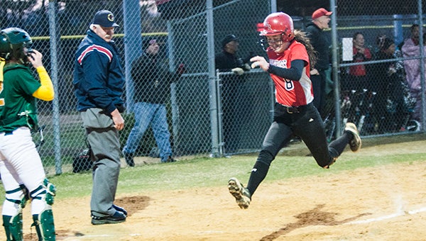 Nansemond River High School junior KateLynn Hodgkiss enjoys her last hop to home plate, which brought Monday's game against visiting Great Bridge High School to a victorious end for the Lady Warriors.