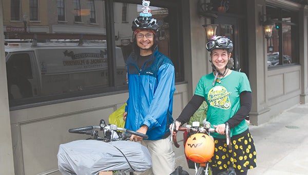 Southern Californians Marcus Peck and Christina Lange passed through Suffolk on Monday while cycling around America. They estimated they’ve covered 5,200 miles so far.