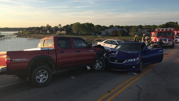 Two men and a woman were transported to the hospital after being involved in this wreck on Bridge Road’s Godwin Bridge Wednesday morning (City of Suffolk photo)