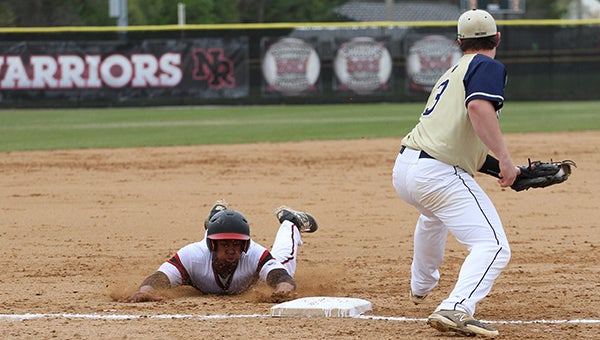  Nansemond River High School senior Kieton Rivers slides in to third base on Thursday against visiting Western Branch High School. Rivers hit his first homer of the season, but the Bruins prevailed 6-3.