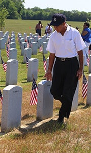 Joe Torres Sr. set a goal of paying respects individually to each of the veterans and family members buried at Albert G. Horton Jr. Memorial Veterans Cemetery on Monday.