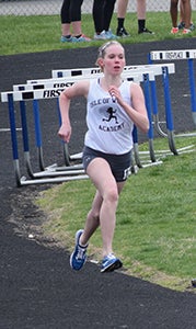 Suffolk’s Betsy Pollard alone represented Isle of Wight Academy on the track this year, running at the varsity level as an eighth-grader. (Photo submitted by Lou Pollard)