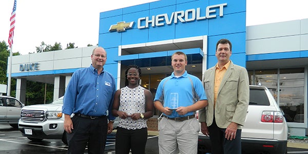 The female and male Duke Automotive-Suffolk News-Herald Spring Players of the Year hold their awards after the presentation on Thursday. From left: Duke Automotive vice president Eley Duke, Cydney Nichols, Robert Fitzwater and Suffolk News-Herald publisher John Carr.