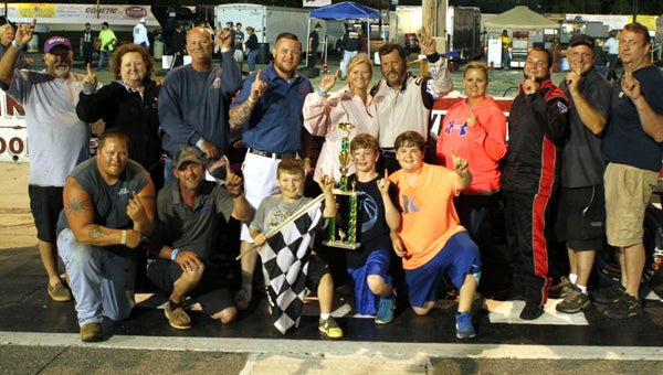 Jimmy Humblet celebrates with his family and crew and three young trophy presenters after his first 50-lap win of the season in the modifieds class of the NASCAR Whelen All-American Series at Langley Speedway on Saturday. (Bill Carr/MotorSports Photo News Service)