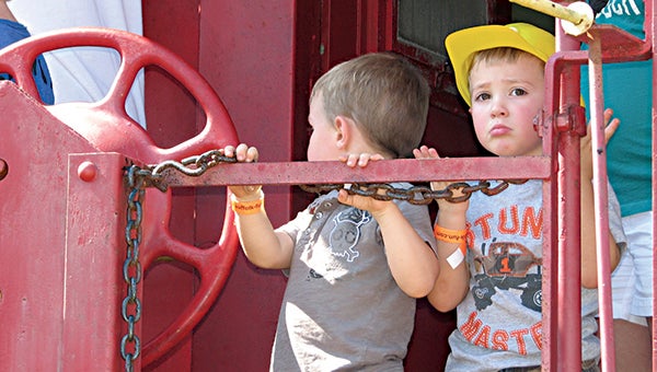 Jack Kokosinski and Michael Work, both 3 at the time, check out the caboose at the Suffolk Seaboard Station Railroad Museum during the 2013 Touch a Truck, Train and More event. The caboose and museum will be showcased again during this weekend’s Hands-On History event.