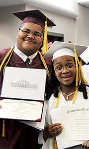 King’s Fork High School graduates Dexter Hardy and Mikaela Ponton show what they both worked so hard for.