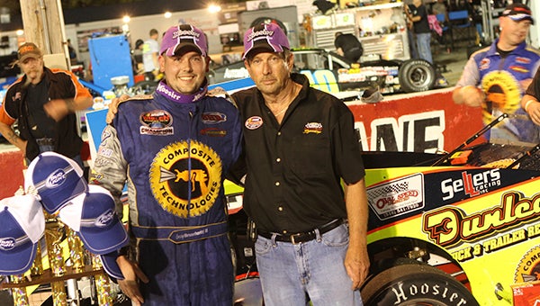 George Brunnhoelzel III celebrates with Langley Speedway owner Bill Mullis after Brunnhoelzel’s dominating win in the “Bayport Credit Union 150 Night At The Races,” a NASCAR Whelen Southern Modified Tour event, on Saturday at Langley Speedway in Hampton. (Bill Carr/MotorSports Photo News Service)