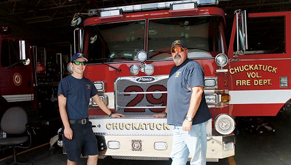 Ryan Foster and Brad Whitley, president of the board of directors support their community by volunteering at the Chuckatuck Volunteer Fire Department. 